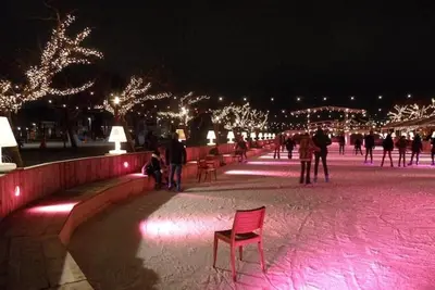 a red chair in a park with lights at night at Group Stay, 7 minutes away from Amsterdam! in Halfweg