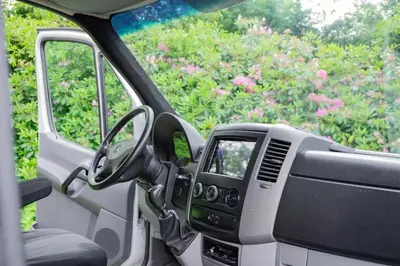 a truck with a steering wheel and a dashboard at Mercedes Sprinter Camper FREYA in Heiloo