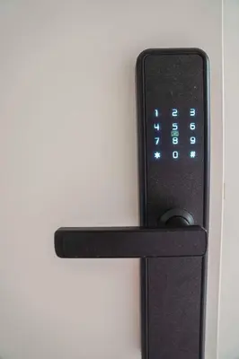 a black remote control attached to a wall at Hotel Koemarkt in Purmerend