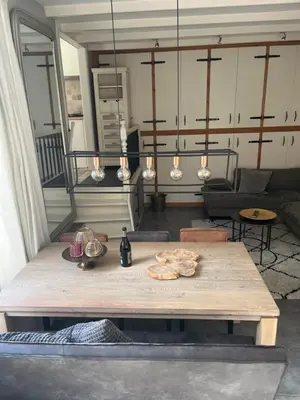 a table in the middle of a living room at De troeter in Monnickendam