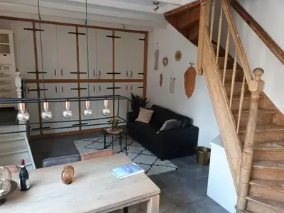 a living room with a couch and a table at De troeter in Monnickendam