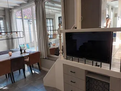 a living room with a large flat screen tv at De troeter in Monnickendam