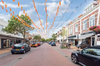 a city street with cars parked on the street at Beach House at C in Zandvoort