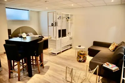 a living room with a couch and a table in a room at Casa del Queso in Alkmaar