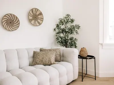 a white living room with a white couch at Bella Cottage Zandvoort in Zandvoort