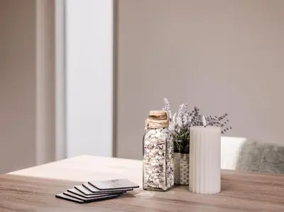 a table with a jar and a candle and a cell phone at Ceebee - Free parking in Zandvoort