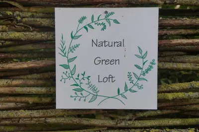 a sign with aanical green leafy design on a wall at natural green loft in Bergen