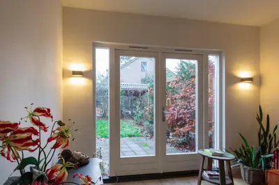 an open door with plants in a room at Petitville in Austerlitz