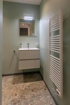 a bathroom with a sink and a mirror at Petitville in Austerlitz