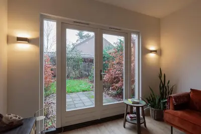 a room with a sliding glass door at Petitville in Austerlitz