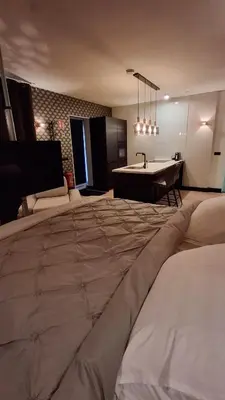 a large bed in a room with a bath tub at Vakantiewoning Hem in Hem