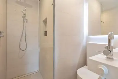 a bathroom with a shower and a toilet at Studio Carlos in Haarlem