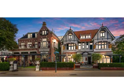 a large house on the corner of a street at Dijkstra Hotels in Bergen