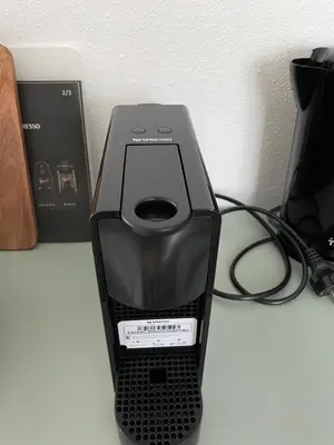 a black printer sitting on top of a table at Beachhouse De Dahlia in Noordwijk aan Zee