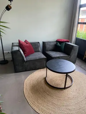 a living room with two couches and a coffee table at M&M guest house in Amsterdam