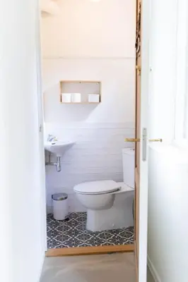 a bathroom with a toilet and a sink at Ben bij Bos in Oude-Niedorp