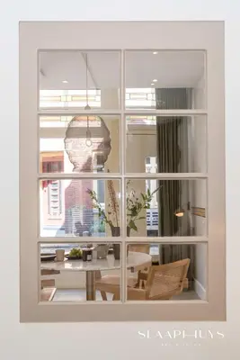 a window view of a dining room with a table at Slaaphuys Bed & Sauna in Alkmaar