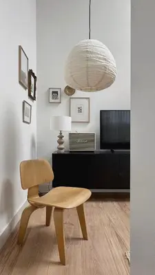 a living room with a chair and a desk at Luxury spacious private loft, between city & beach in Heemstede