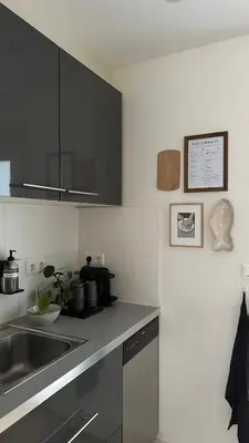 a kitchen with a sink and a counter top at Luxury spacious private loft, between city & beach in Heemstede