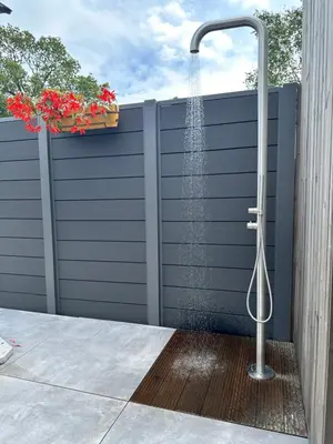 a shower on a privacy fence with a shower at Pakhuis Prins in Zaandam