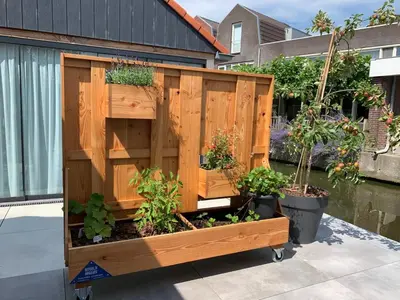 a wooden garden box with plants in it at Pakhuis Prins in Zaandam