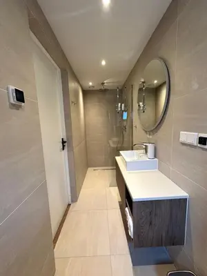 a bathroom with a sink and a mirror at Pakhuis Prins in Zaandam