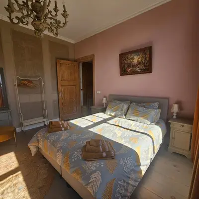 a bedroom with a bed with two towels on it at B&B Boskoop in Boskoop