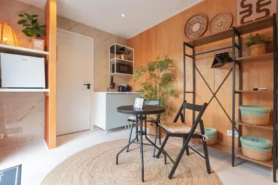 a kitchen with a table and chairs in a room at Beachhouse Rina - Free Parking in Zandvoort