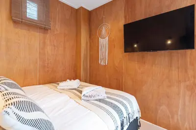 a bedroom with a bed with a basketball on the wall at Beachhouse Rina - Free Parking in Zandvoort