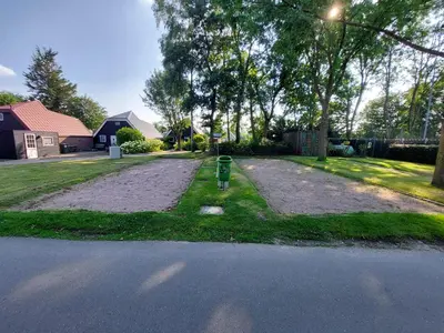a parking meter on the side of a road at Ferienhaus Holland in Opmeer