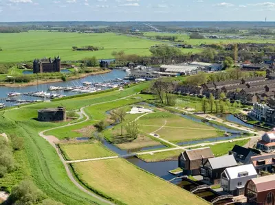 an aerial view of a small town next to a river at Villa Amsterdam Castle in Muiden