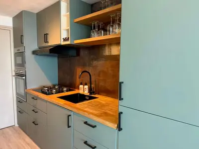 a kitchen with a sink and a counter top at Beach Loft in Zandvoort