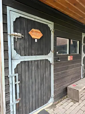 a wooden garage door on a house at Back to Basic in Zwaanshoek