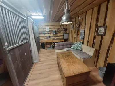 a living room with a couch and a table at Back to Basic in Zwaanshoek