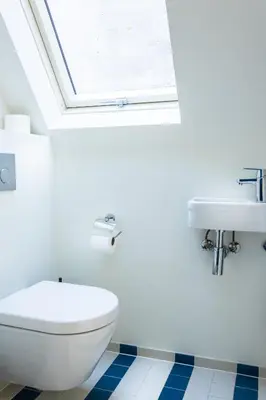 a bathroom with a toilet and a sink at Central Art Apartment - Nieuwmarkt area in Amsterdam