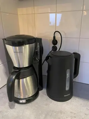 a coffee maker and a blender on a counter at Burgervlotbrug aan zee met sauna in Burgerbrug