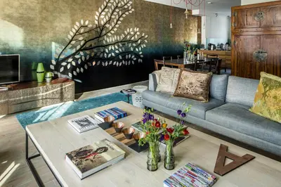 a living room with a couch and a table at KeizersgrachtSuite471 in Amsterdam