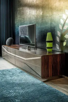 a living room with a television on top of a dresser at KeizersgrachtSuite471 in Amsterdam