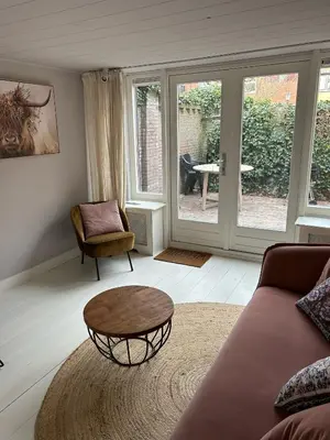 a living room with a couch and a coffee table at Westerhuysje in Uitgeest