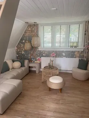 a living room with a couch and a table at Hartje Bergen in Bergen