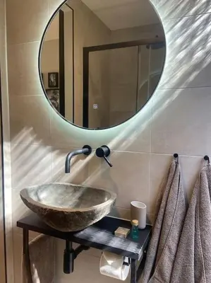 a bathroom with a sink and a mirror at Casa Wess in Zandvoort
