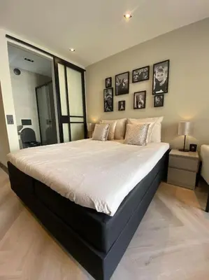 a bedroom with a large bed in a room at Casa Wess in Zandvoort