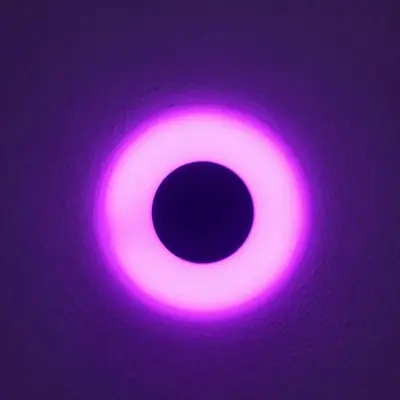 a pink light on top of a purple ceiling at Hermitage Suites & Apartments - Amsterdam Zaandam in Zaandam
