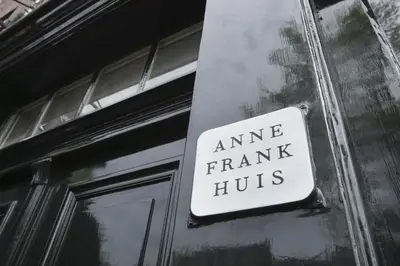 a sign on the side of a building that reads immune fraud huts at Hermitage Suites & Apartments - Amsterdam Zaandam in Zaandam