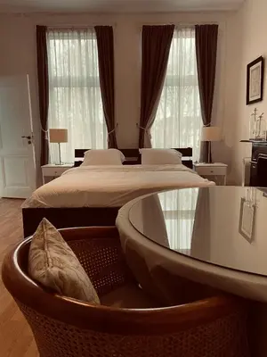 a bedroom with two beds and a large window at Bed and Breakfast Always Good in Utrecht