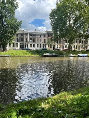 a building next to a body of water at Bed and Breakfast Always Good in Utrecht