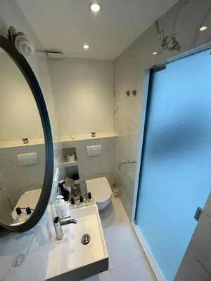 a bathroom with a mirror and a sink and a toilet at Bed and Breakfast Always Good in Utrecht