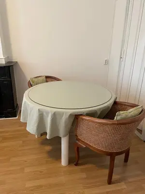 a table with two chairs and a table with a white table cloth at Bed and Breakfast Always Good in Utrecht