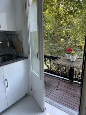 an open door to a kitchen with a balcony at Bed and Breakfast Always Good in Utrecht