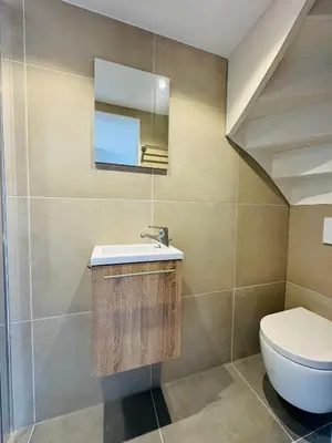 a bathroom with a sink and a toilet at Ocean Breeze - Noordwijk aan Zee in Noordwijk aan Zee